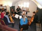 Vivien &#039;organising&#039; six viols players<br />in another Skittle Alley scratch band